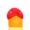 Peluche a forma di pene arcobaleno, con un'espressione sorridente e accogliente, perfetto come regalo scherzoso o per aggiungere un tocco di allegria a qualsiasi spazio. Disponibile su desirevibe.com